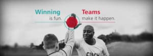 Photo of an adult sports coach high-fiving an adolescent team player. Overlaying text reads "Winning is fun. Teams make it happen."